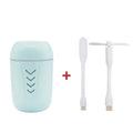 Blue columnar car humidifier with USB cable and mechanical controls on dashboard