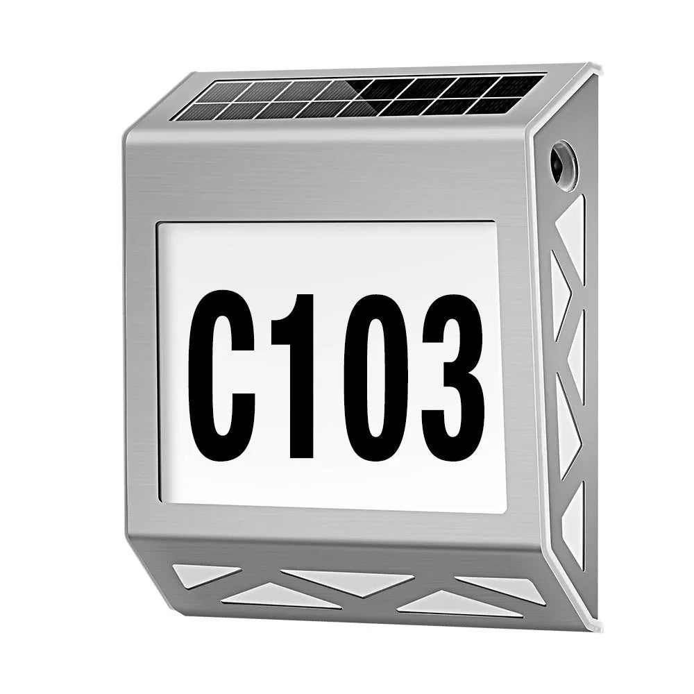 Black solar-powered doorplate light with LED illumination for house numbers measuring 180x50x200mm