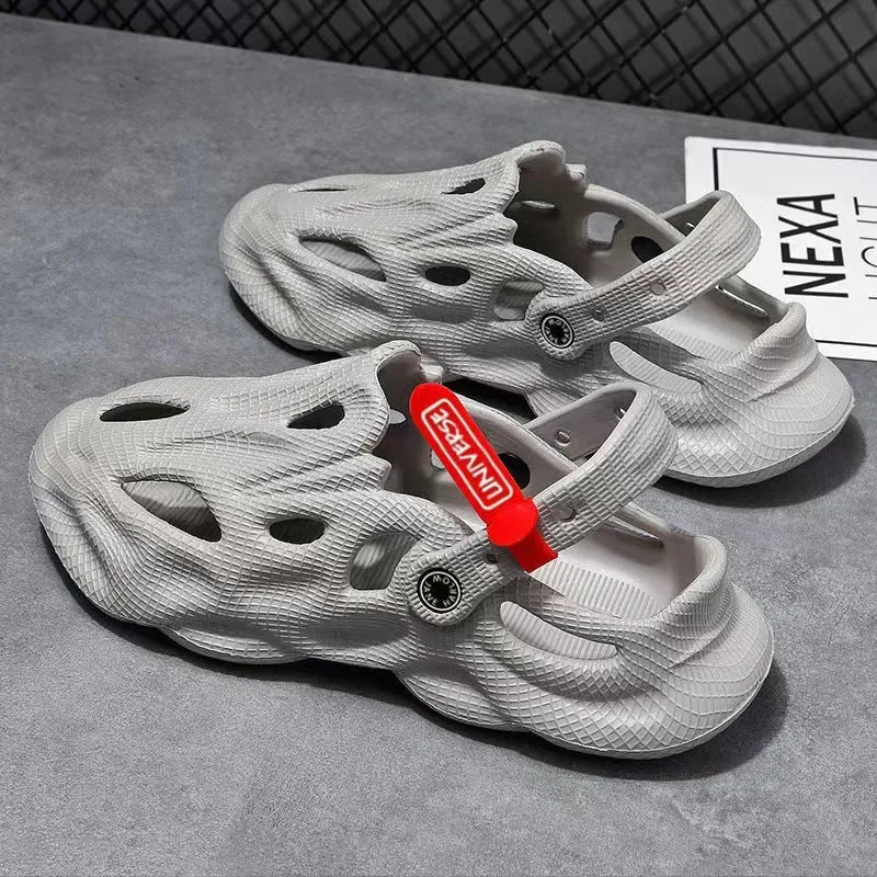 Grey closed toe EVA coconut slippers on a beach background, showing toe cap design and textured sole.