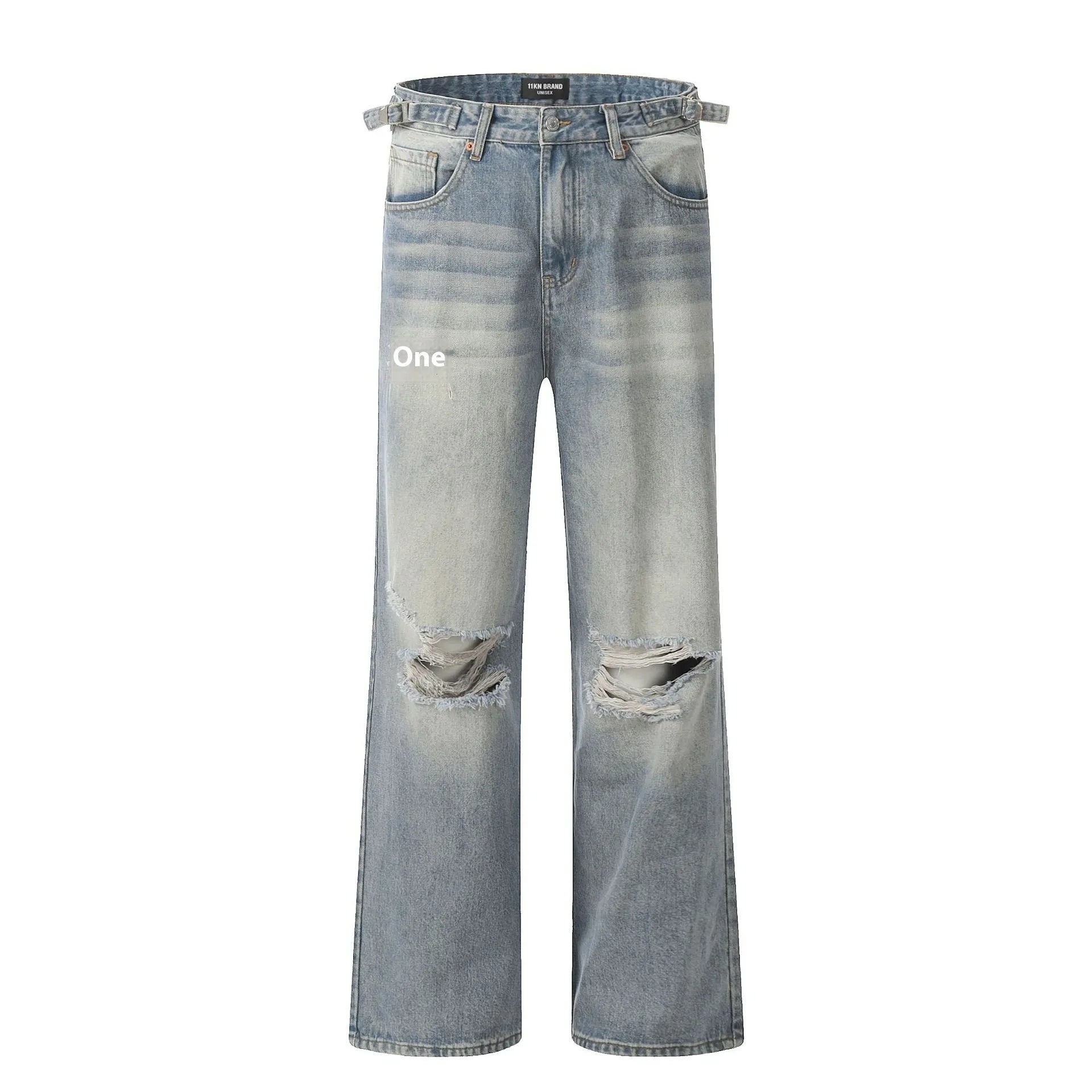 Man wearing blue straight-leg jeans with ripped detailing and an adjustable waistband.