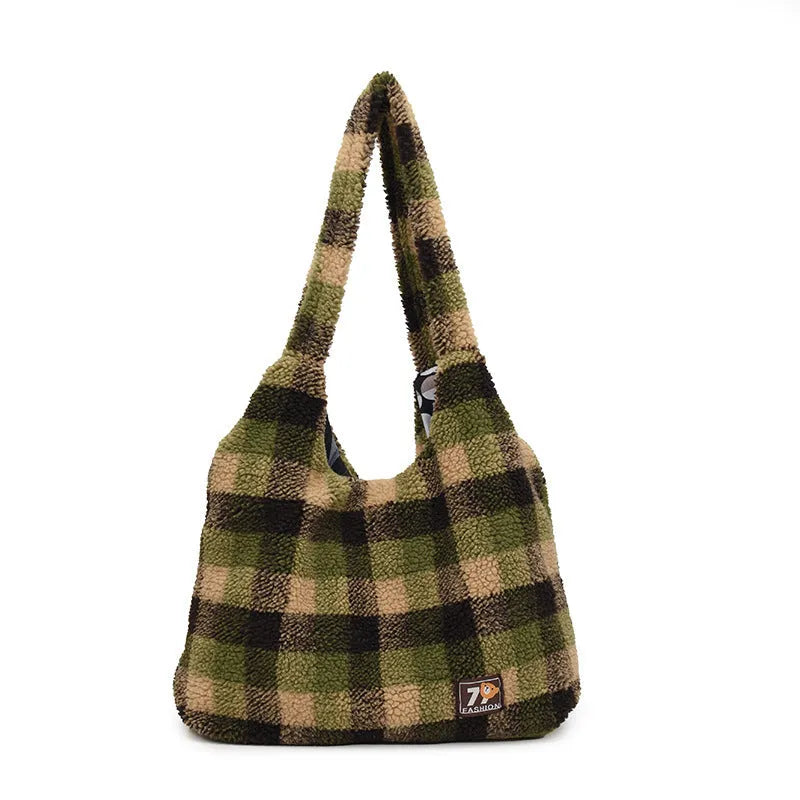 Women's plaid pattern crossbody tote bag showing soft plush material and horizontal square shape with crossbody strap.