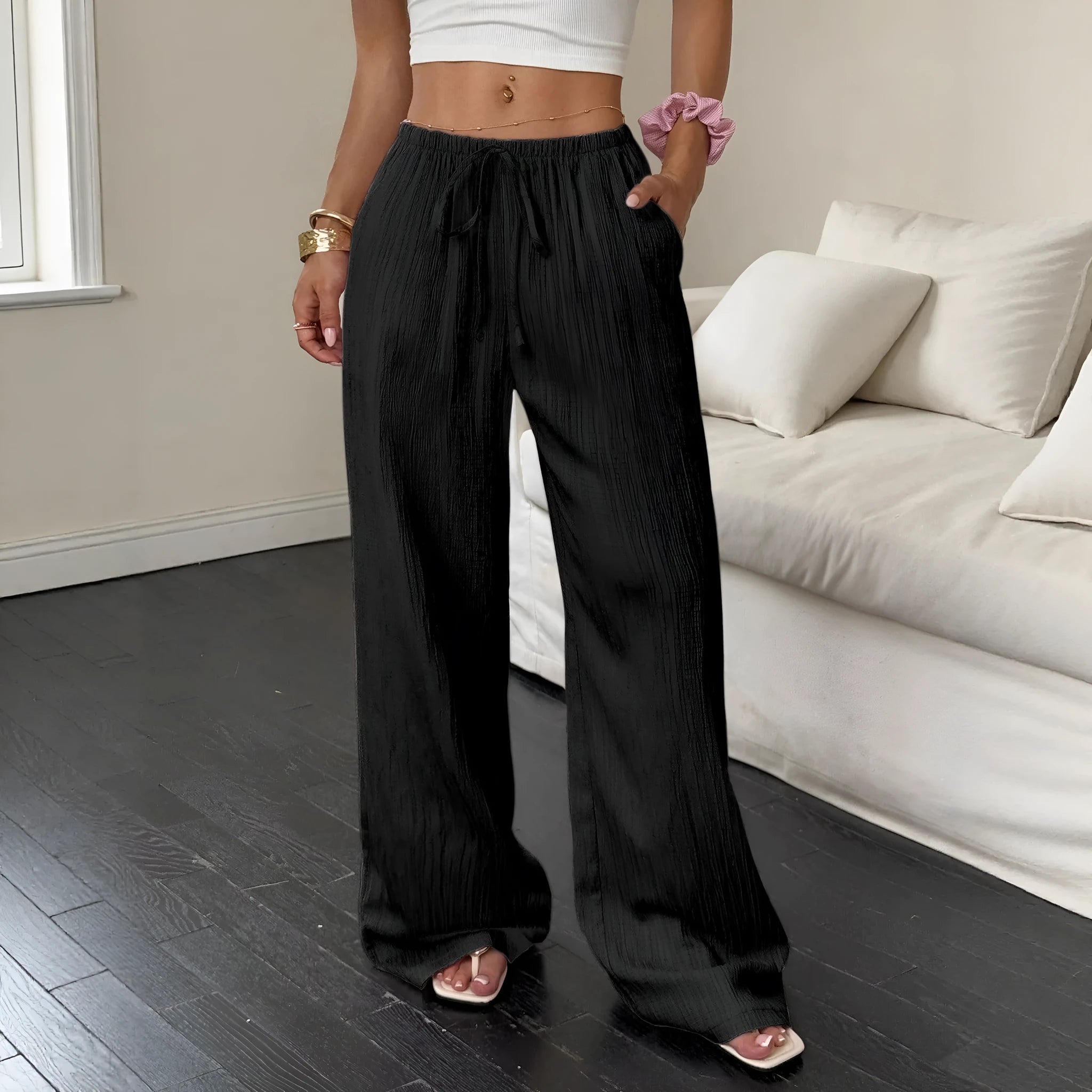 Women's black wide-leg trousers with lace-up waist detail on mid-waist