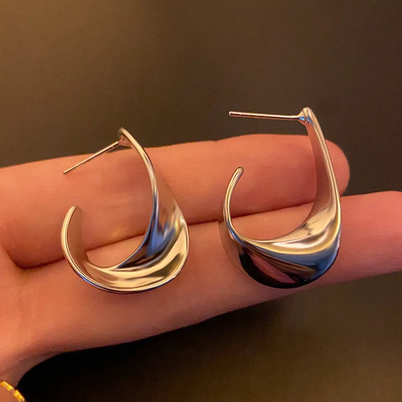 Twisted geometric metal earrings with electroplated gold or silver finish