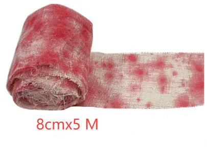Roll of Halloween horror dyed gauze bandage in bloody red colour, shown with a loose end draped.