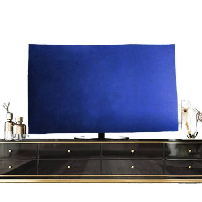 A pink velvet television cover draped over a flat-screen TV, showing its elasticated hem and soft fabric texture.