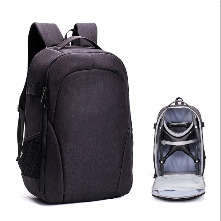 Large black Oxford fabric drone backpack showing multiple internal organiser pockets for laptop and camera.