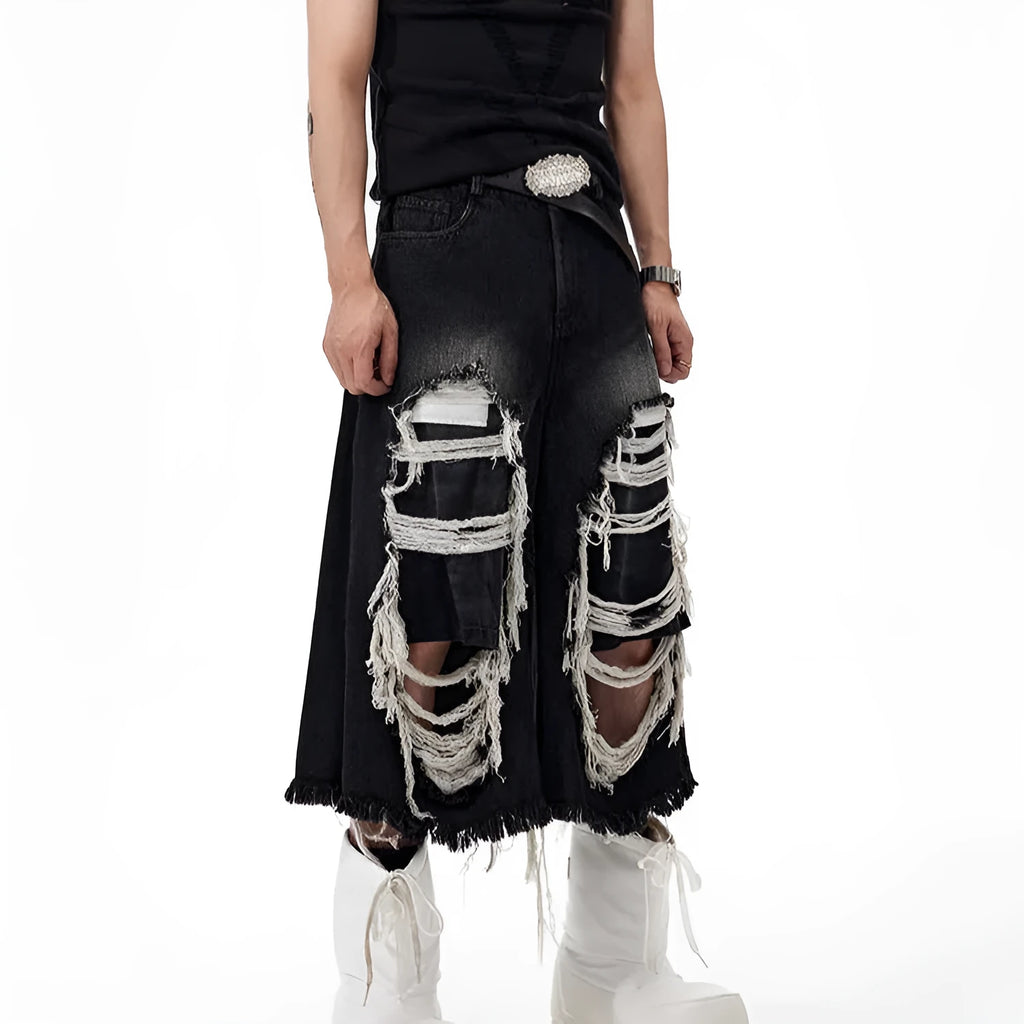 Black wide-leg cropped jeans with ripped patch detail on the legs, showing a mid-high waist and loose fit.