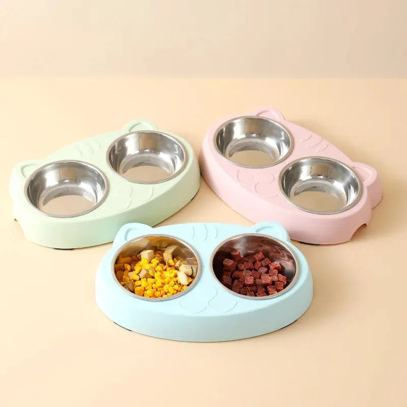 Blue macaron-styled double bowl plastic feeder tray for cats and dogs on a wooden floor.