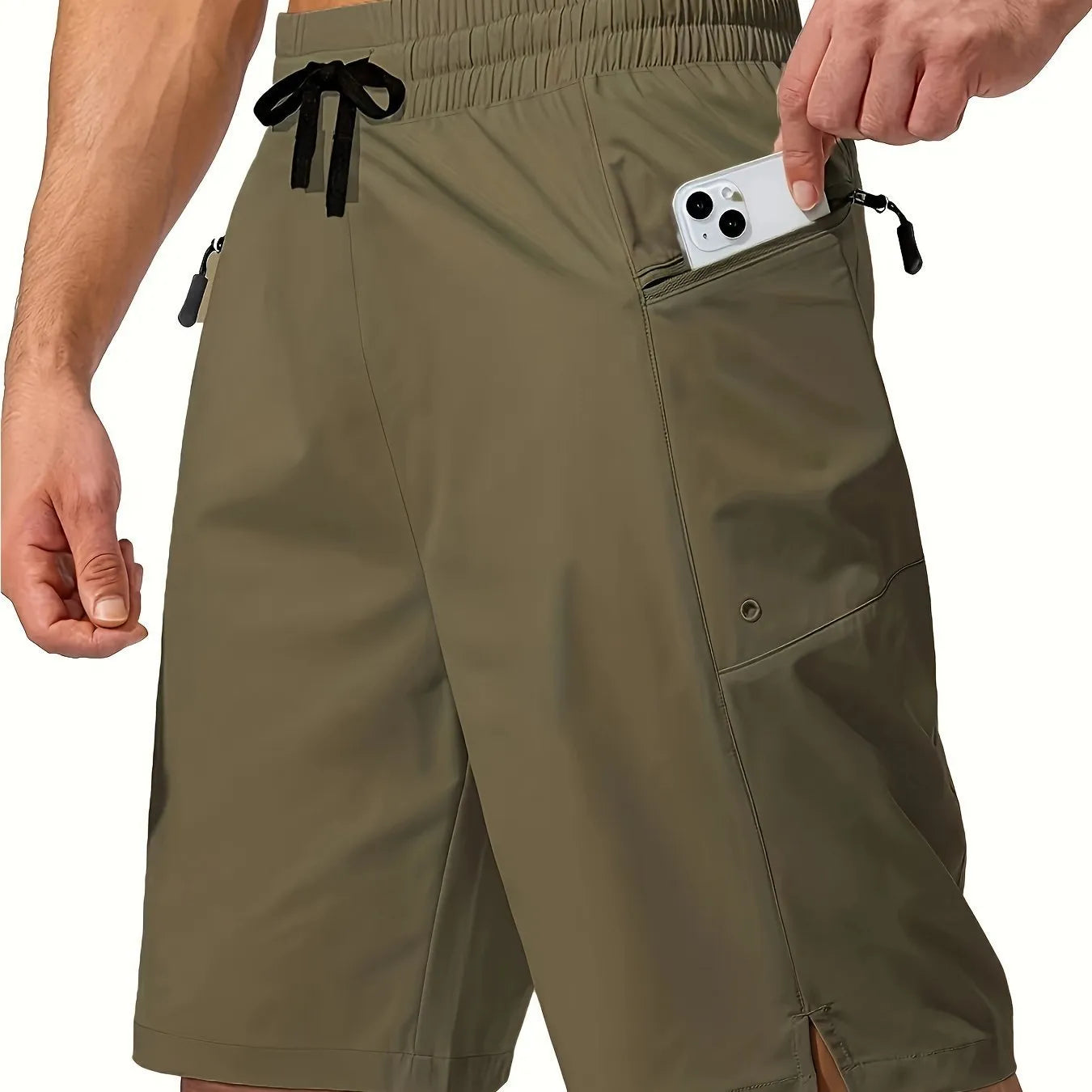 Man wearing solid colour quick-drying polyester beach shorts in a straight leg fit.