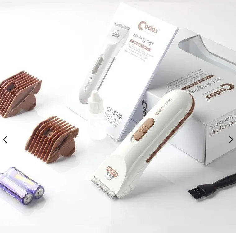 White electric pet hair clipper with ceramic blade for grooming dogs and cats.