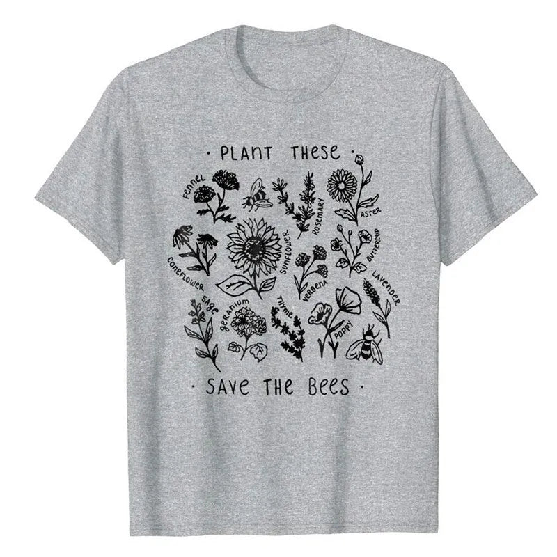 Woman wearing a white cotton Save The Bees t-shirt with a cartoon natural scenery print