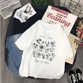 Woman wearing a white cotton Save The Bees t-shirt with a cartoon natural scenery print