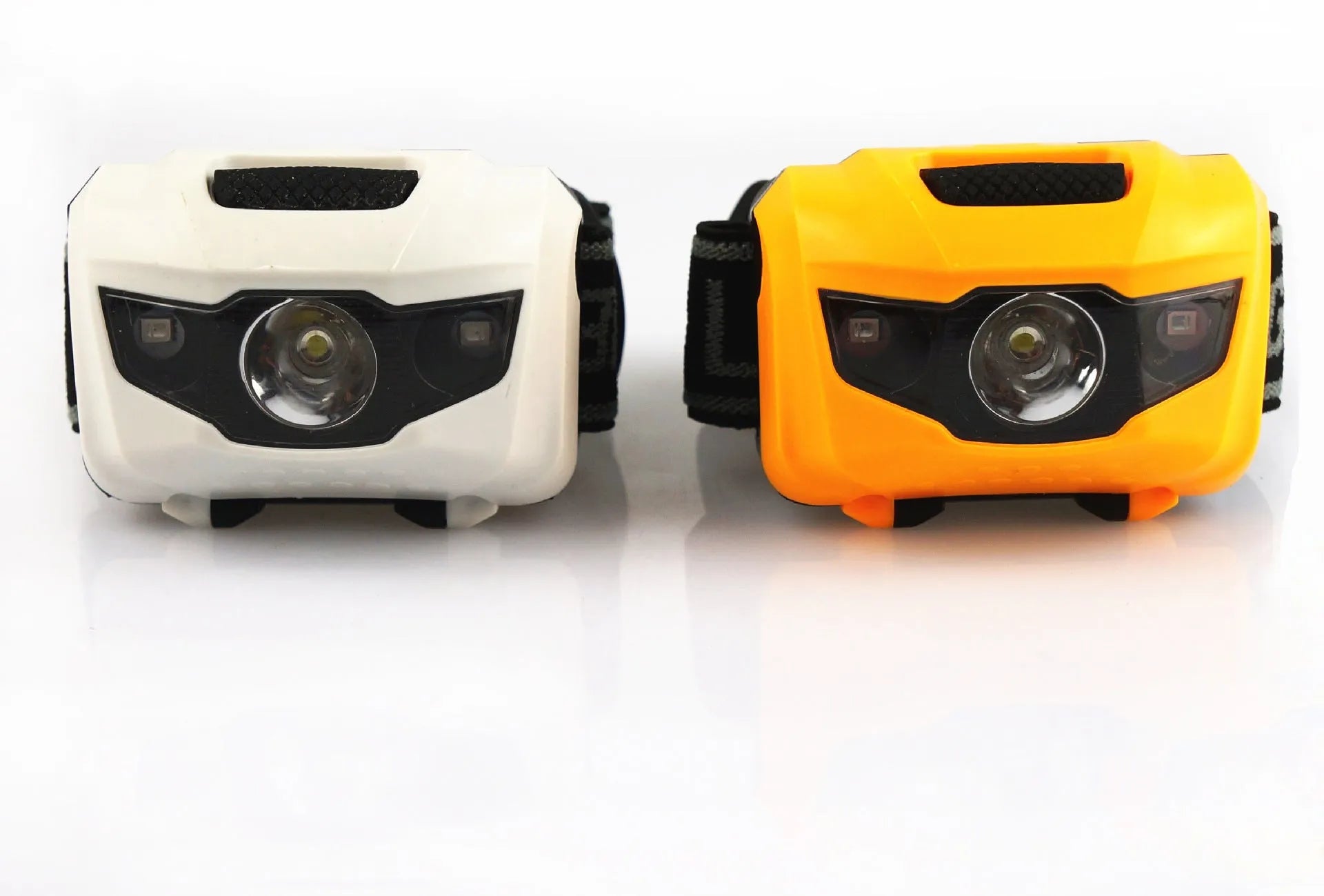 Black waterproof head torch with white and red LEDs mounted on adjustable headband for outdoor use.