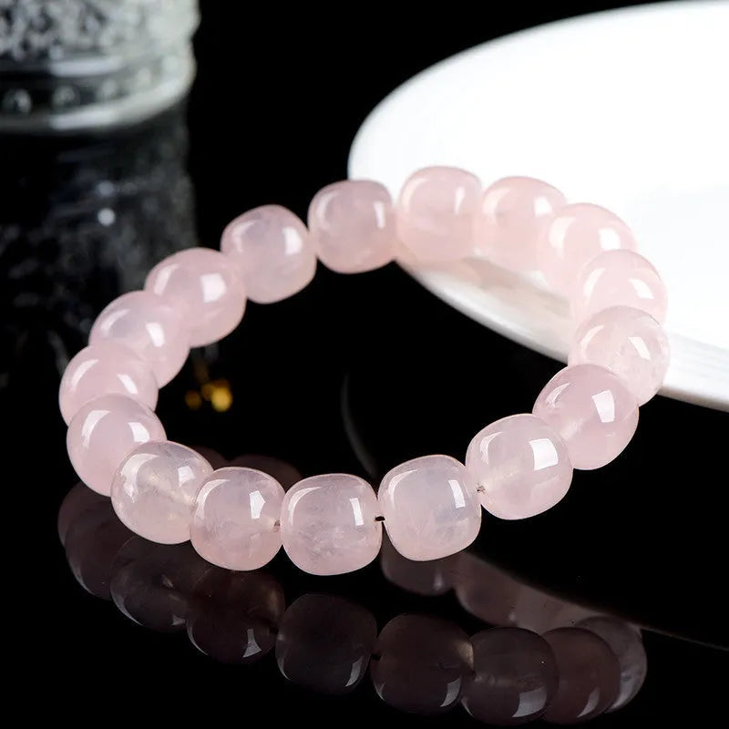Pink bamboo crystal bracelet with 11-12mm barrel beads and geometric elements