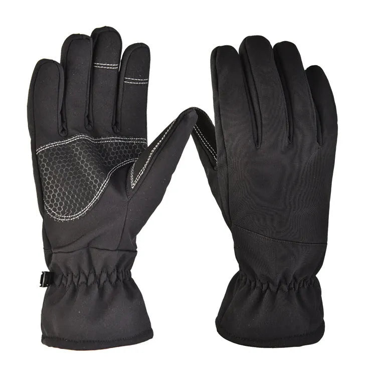 A pair of tactical camouflage ski gloves with touch-screen fingertips on a winter background.