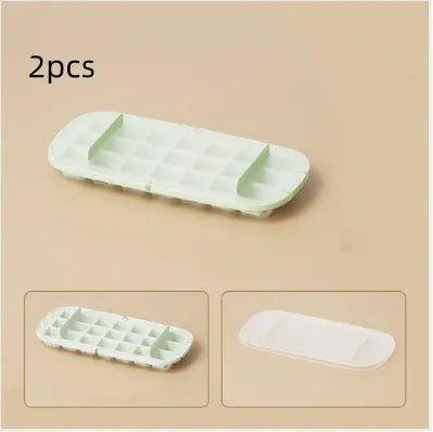 High-capacity ice cube tray in blue with leverage handle and integrated ice shovel storage compartment