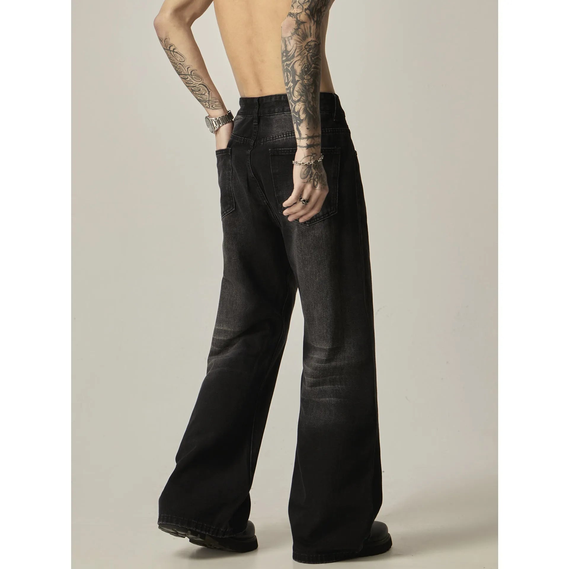 Black retro straight-leg jeans with zip fly opening and loose fit on size chart