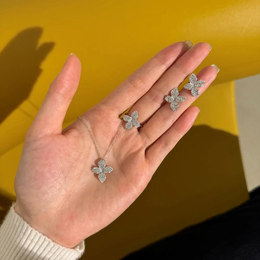 925 silver jewellery suite with white round zirconium flower design open ring, clavicle chain necklace, and ear studs in gold