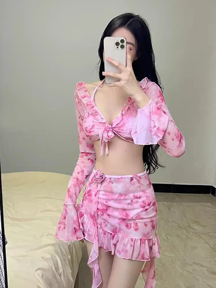 Women's cherry blossom pink floral bikini swimsuit set on a white background.