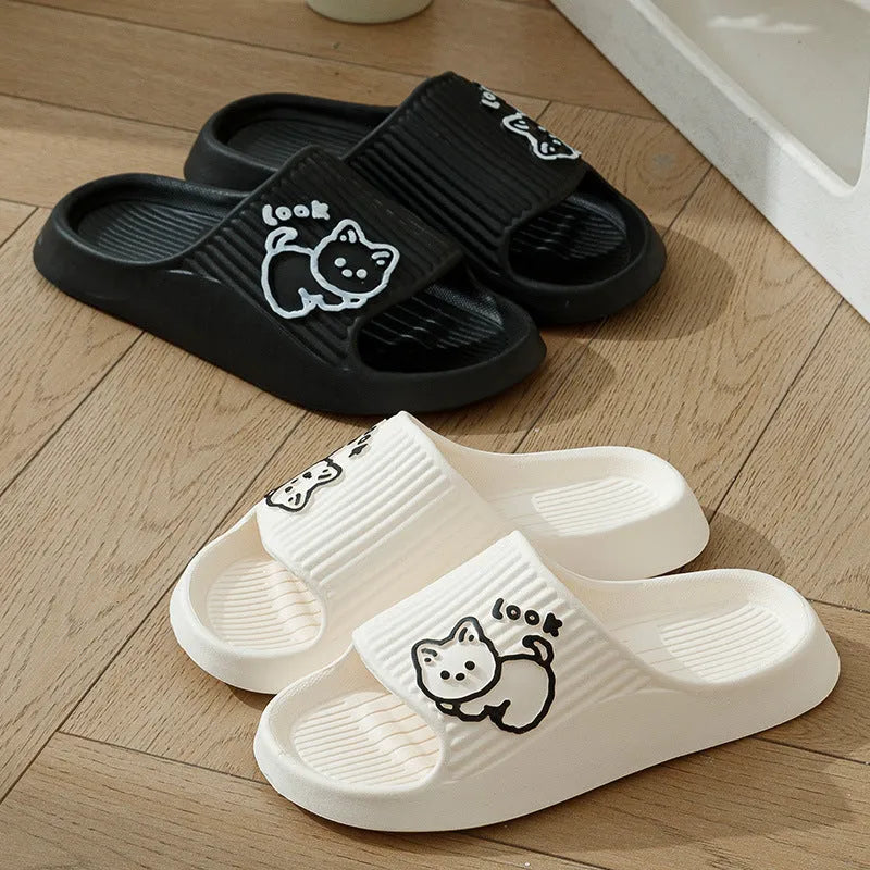 Green EVA platform flip flop slippers with a raised cat design on the upper.