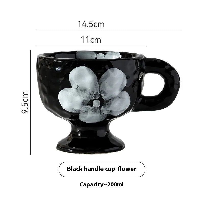 Hand-pinched irregular ceramic mug in solid colour with modern simple design
