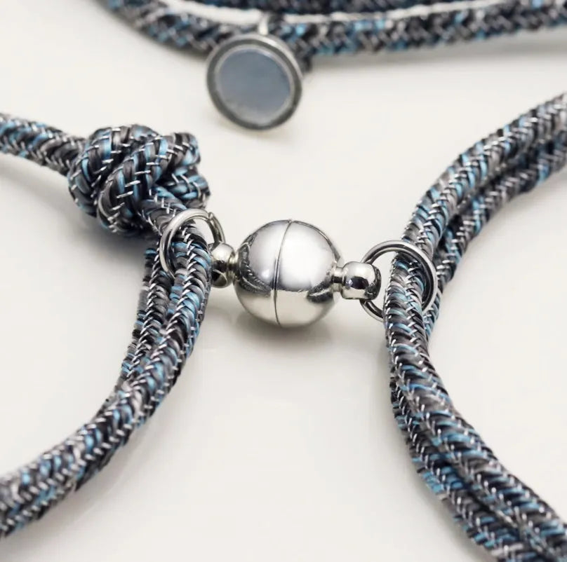 Pair of stainless steel magnetic couples bracelets with silver and rose gold finish, adjustable rope length