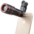 12x magnification black phone telephoto lens with mounting clip on a smartphone