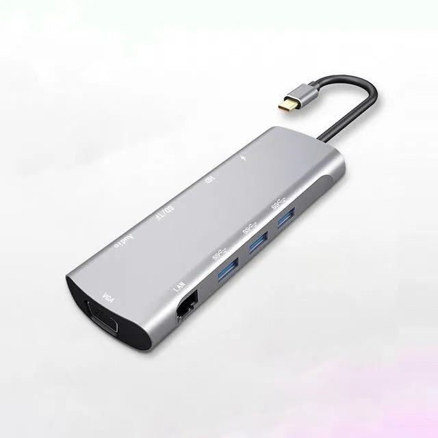 Grey USB-C docking station with HDMI, VGA, and USB 3.0 ports on aluminium alloy body