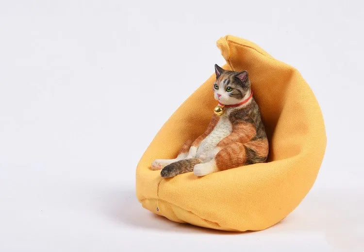 Lazy cat car ornament figure with sofa accessory on dashboard