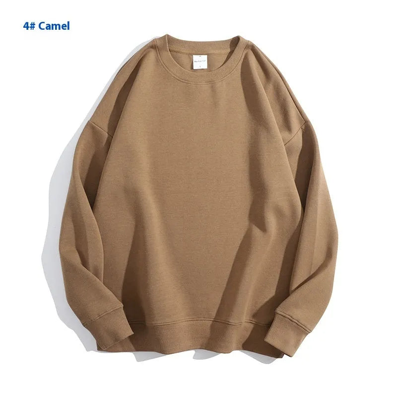 A loose-fitting, off shoulder, round neck cotton sweater in a solid colour with long sleeves.