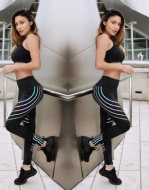 Women's black and white glow-in-the-dark workout leggings with slim-fit design