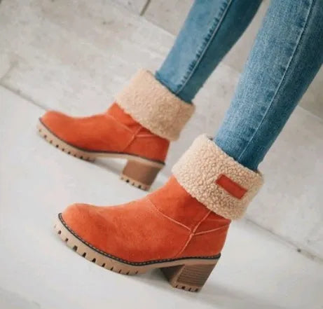 Women's suede mid-calf snow boots in multiple colours with a flat heel and round toe.