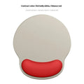 Silicone mouse mat with wrist rest in gradient colour pattern on desk