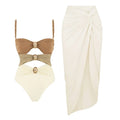 Women's solid colour one-piece swimsuit with gold buttons and matching skirt