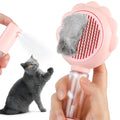 Grey spray cat brush with release button on a white background, showing the bristle head and spray nozzle.
