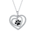Women's copper necklace with dog paw print pendant and heart charm on cross chain