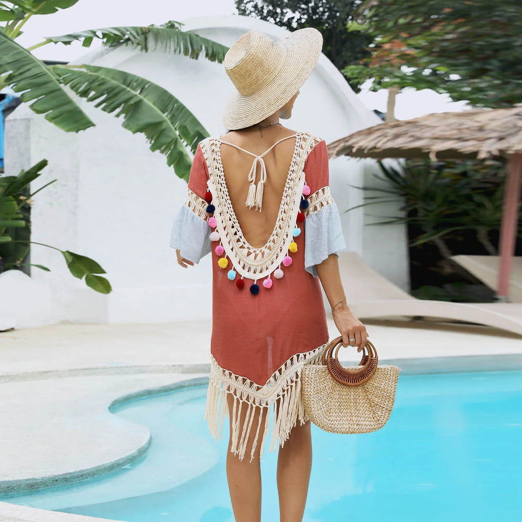 Orange hand crochet beach overskirt with floral pattern and tassel trim