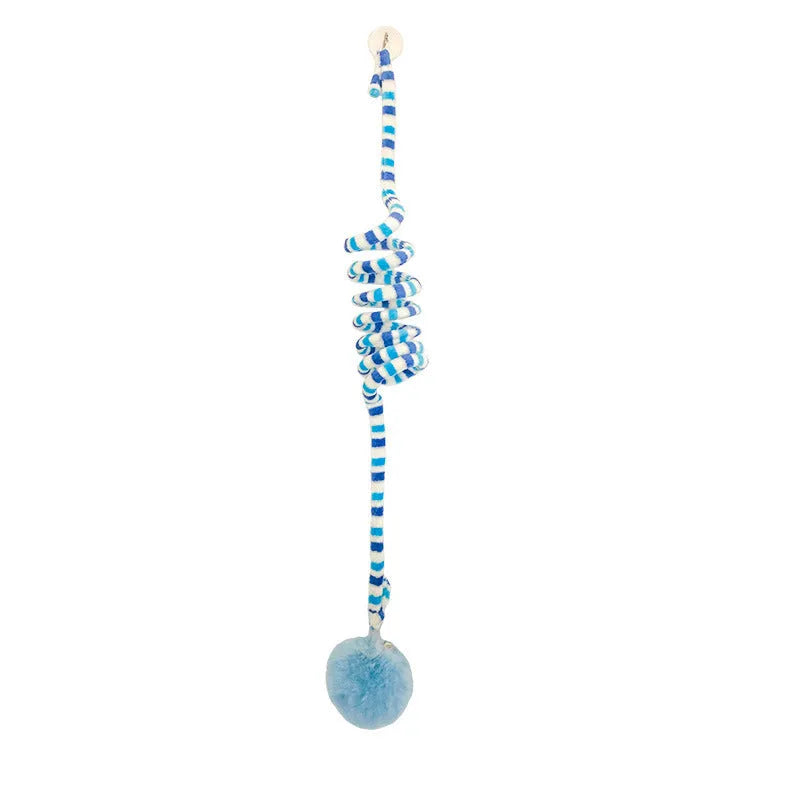 Kitten playing with hanging spring toy featuring inflatable ball and suction cup mount in various colours