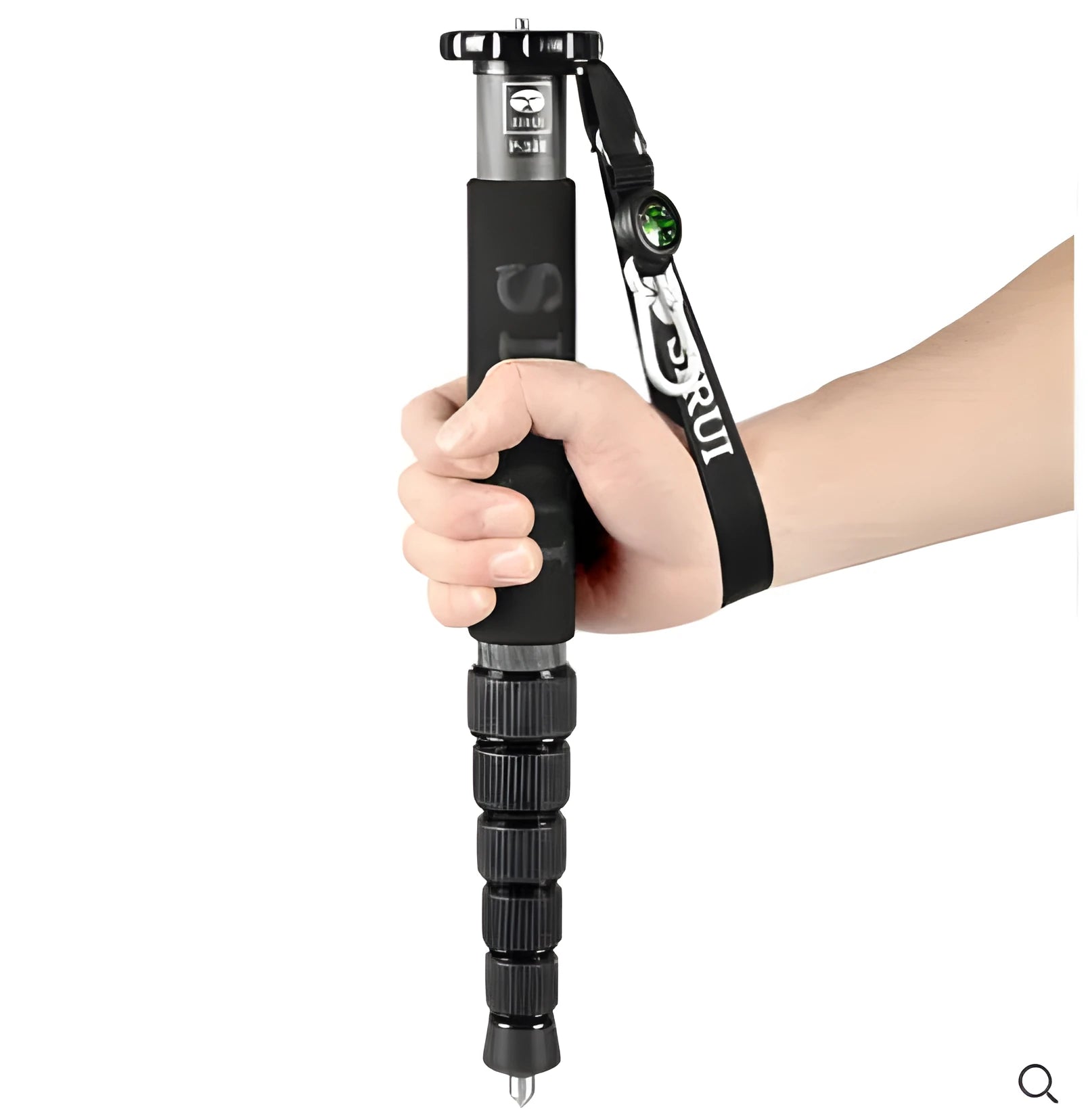 Black carbon fibre monopod for SLR cameras extended to maximum height showing 6 sections