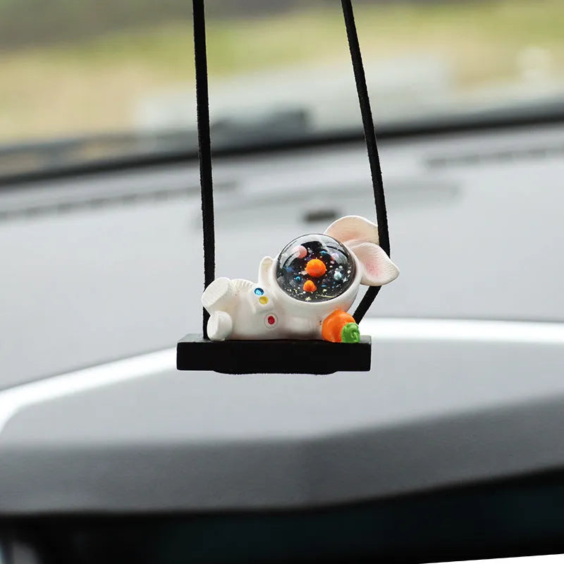 Resin cartoon astronaut car pendant showing designs like astronaut with telescope and astronaut holding a radish.