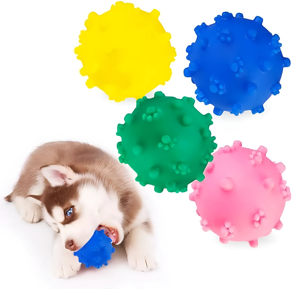Bright blue, green, pink, and yellow spiked dog toy balls with paw print dimples on a white background.