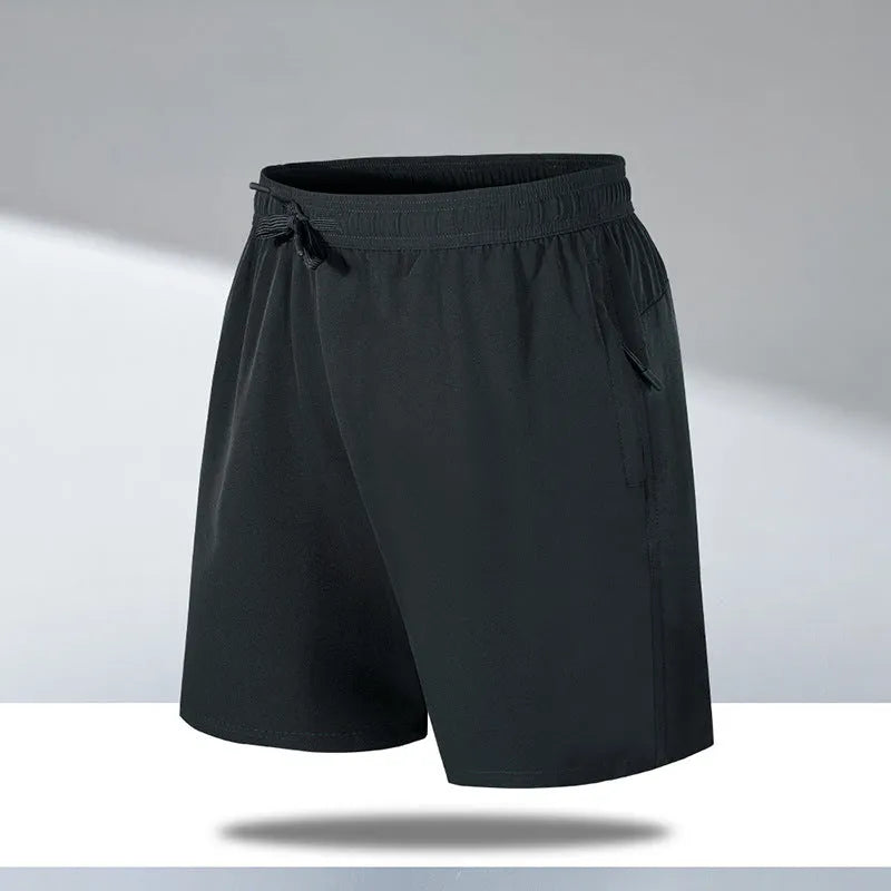 Men's loose fit quick-drying sports shorts in polyester fabric for summer activities