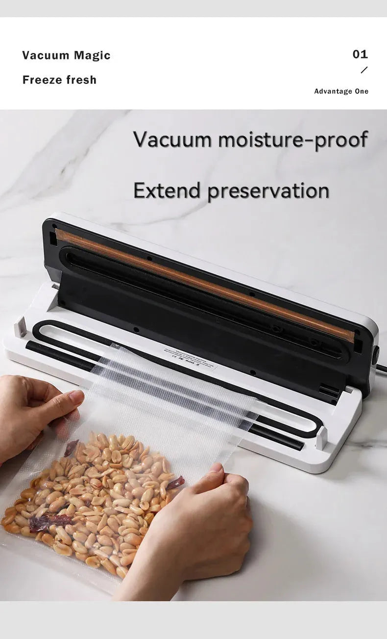 Small black automatic vacuum sealer machine on a kitchen countertop