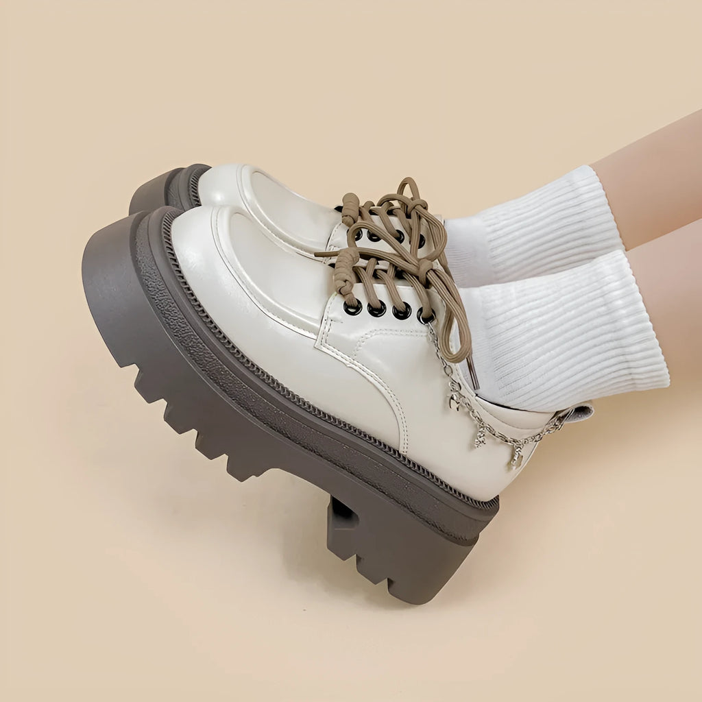 White Amy And Mai PU leather Mary Jane platform shoes with chunky heel and lace-up front.
