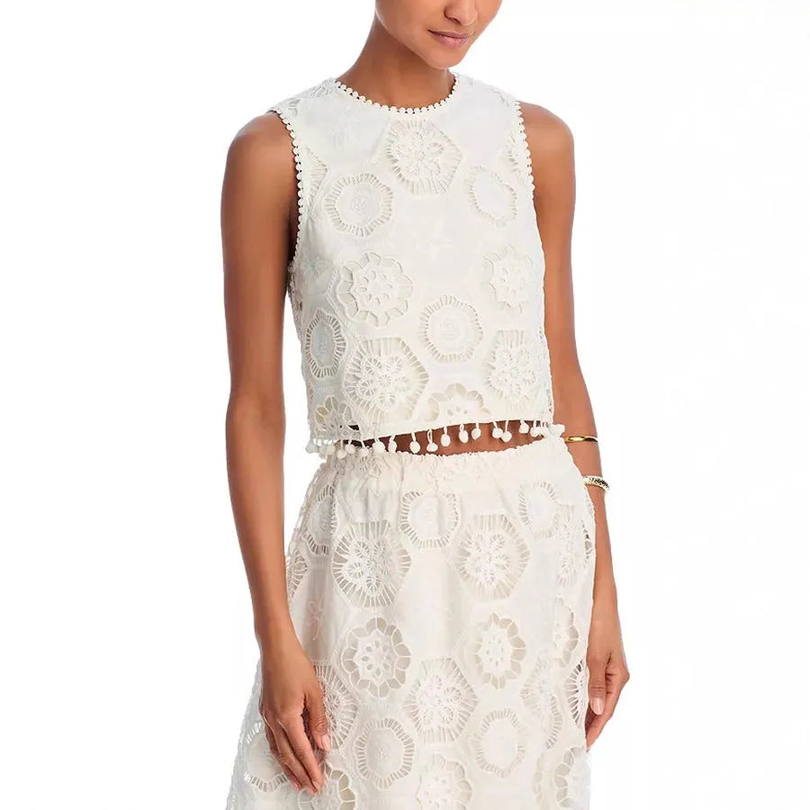 White women's retro suit set with sleeveless top and embroidered long skirt