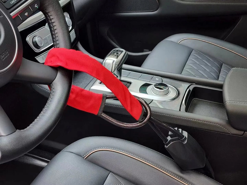 Red iron steering wheel lock with cable design for General Motors cars showing 33cm size