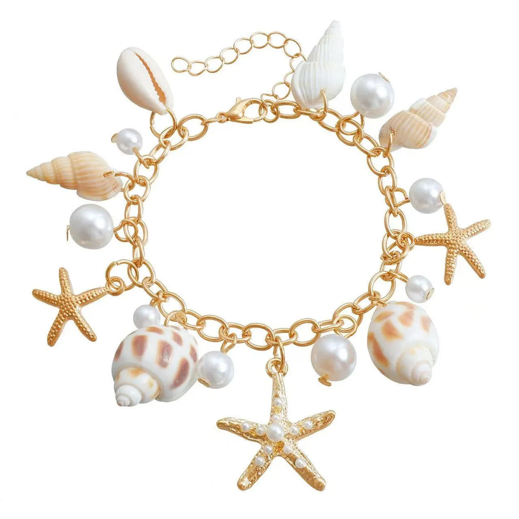 Women's silver alloy waist chain and bracelet set with star charms and beach shell pendant on white background