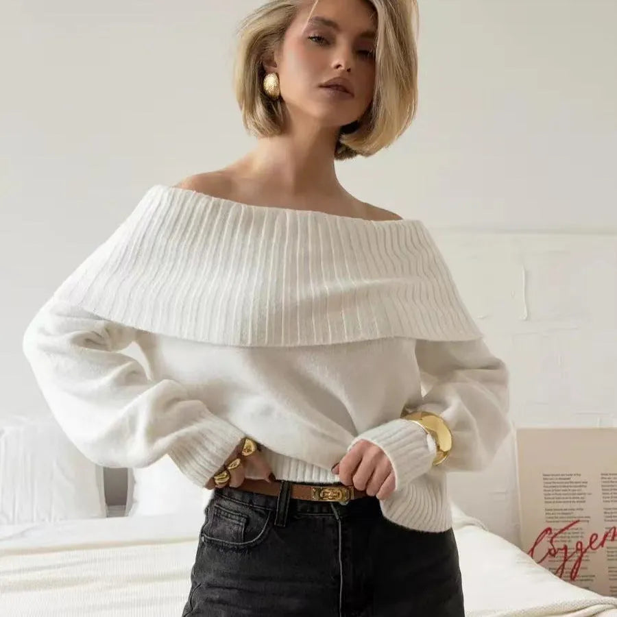 Grey off-the-shoulder sweater with a 3D pattern texture, showing strapless neckline design.