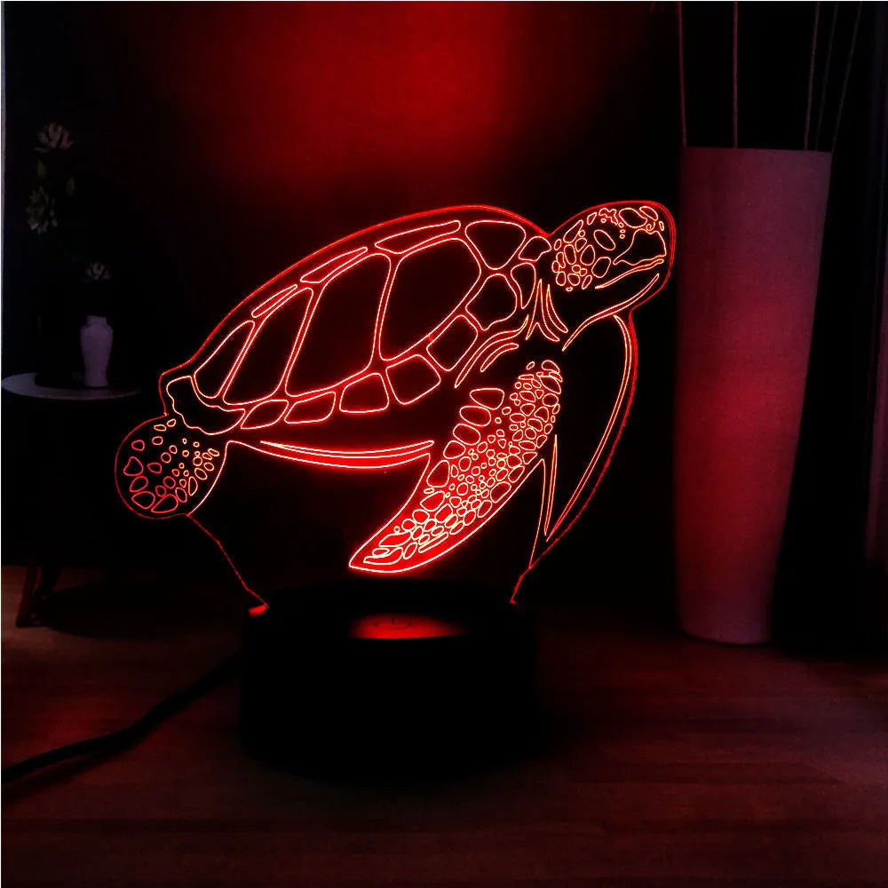 3D acrylic turtle-shaped LED night light showing colour-changing glow and remote control.