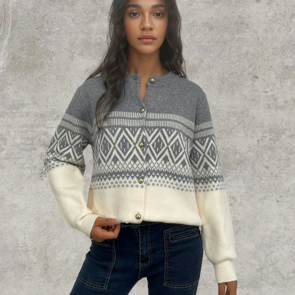 Red women's alpaca wool cardigan with grey diamond knit pattern and long sleeves.
